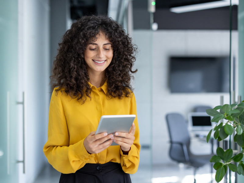 woman looking at tablet